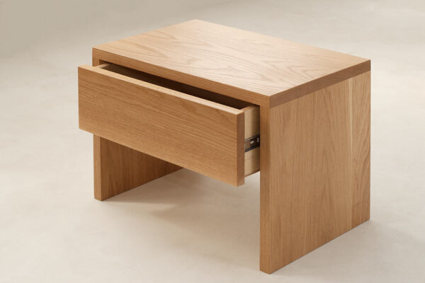 Kyoto drawer table in oak with open drawer. Angled view.