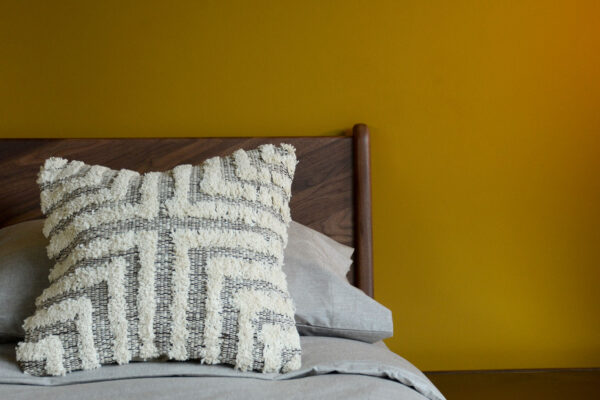 Brown Cream Tufted Cross Cushion on Walnut Hoxton