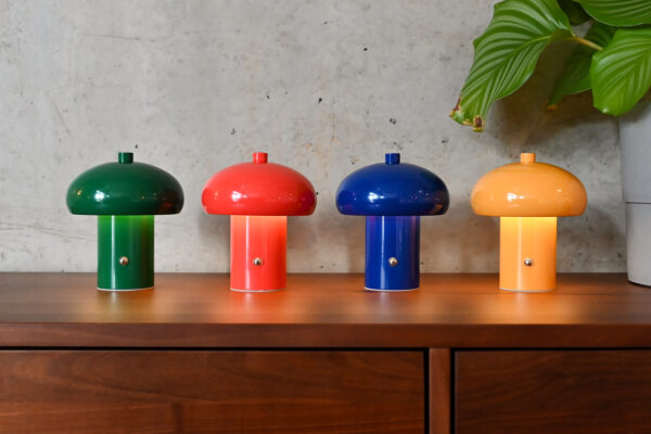 Collection of small, rechargeable retro style lamps in four different colours; green, red, blue and yellow.