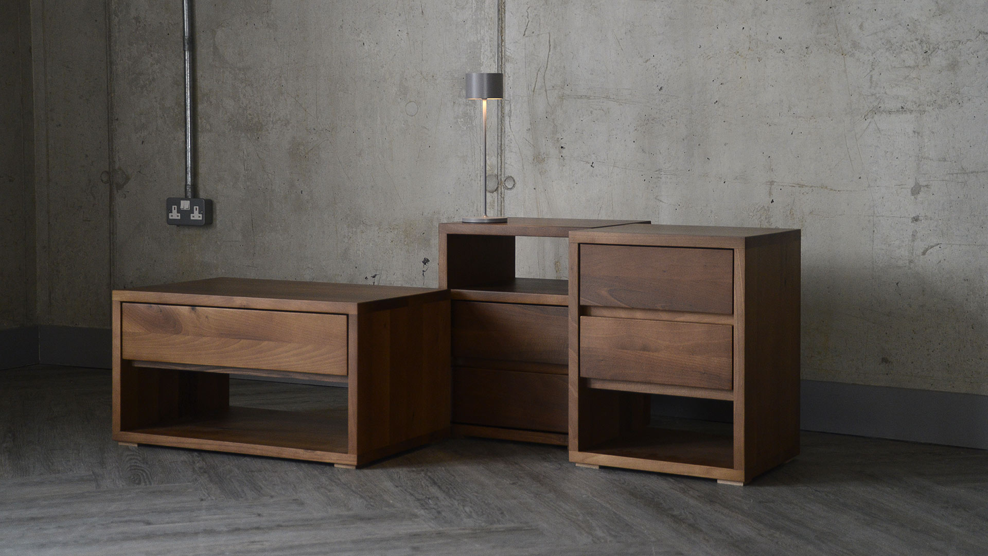 Image showing various matching furniture items from the Black Lotus Cube range. From left to right, you can see the one drawer low bedside unit, the two drawer unit with upper shelf and the two drawer unit with lower shelf.