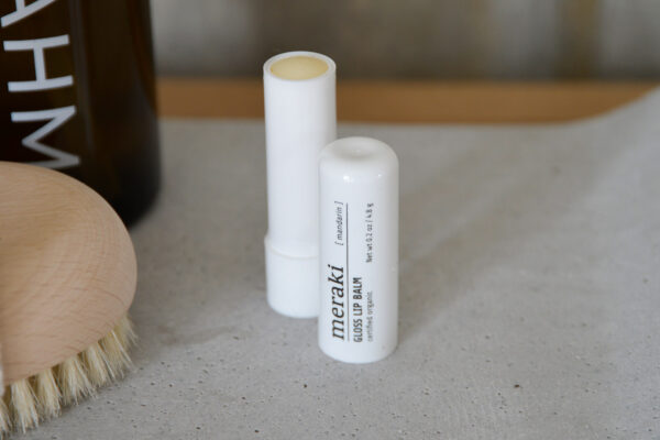 Meraki lip balm photographed with the lid off so you can see the product within.