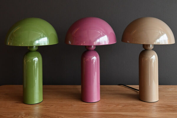 Green, pink and brown modern dome lamps in a row.
