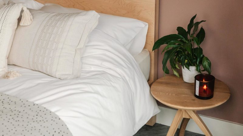 PF candle on twist bedside table with Malabar bed