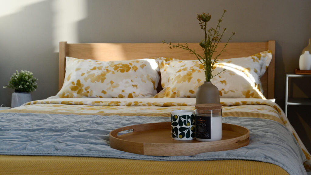 Springtime yellow bedding on Zanskar tray and vase
