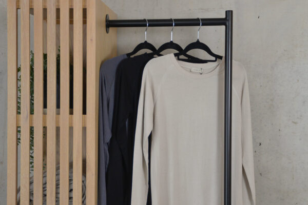 3 long sleeve thsirts hanging on a rail - stone, black and charcoal.