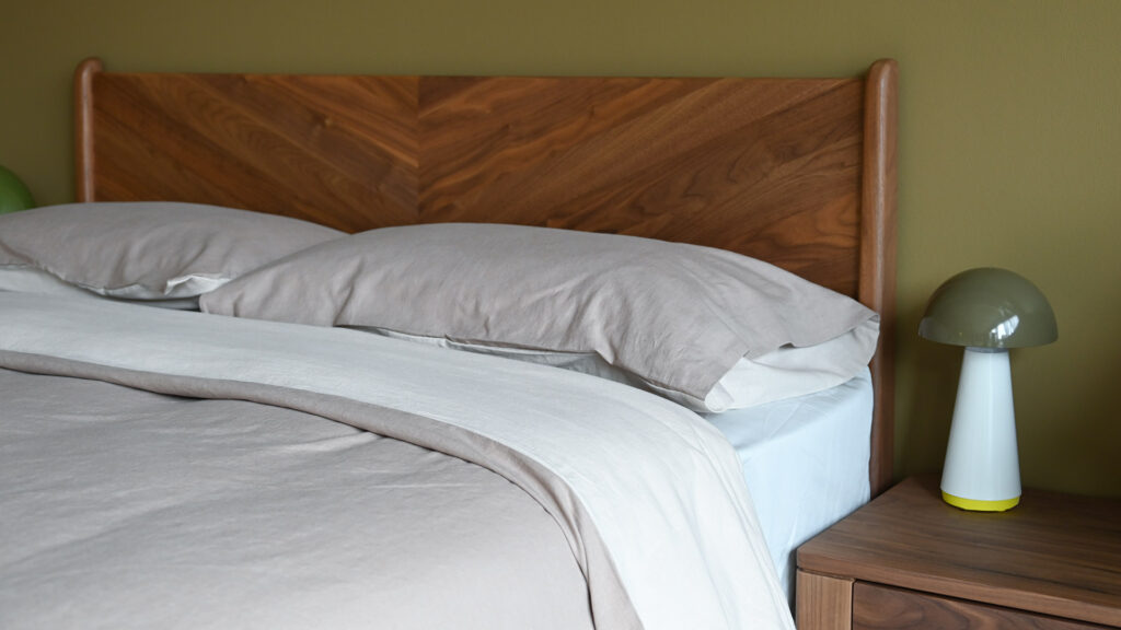 Cotton & linen bedding from Christy on walnut Hoxton bed.