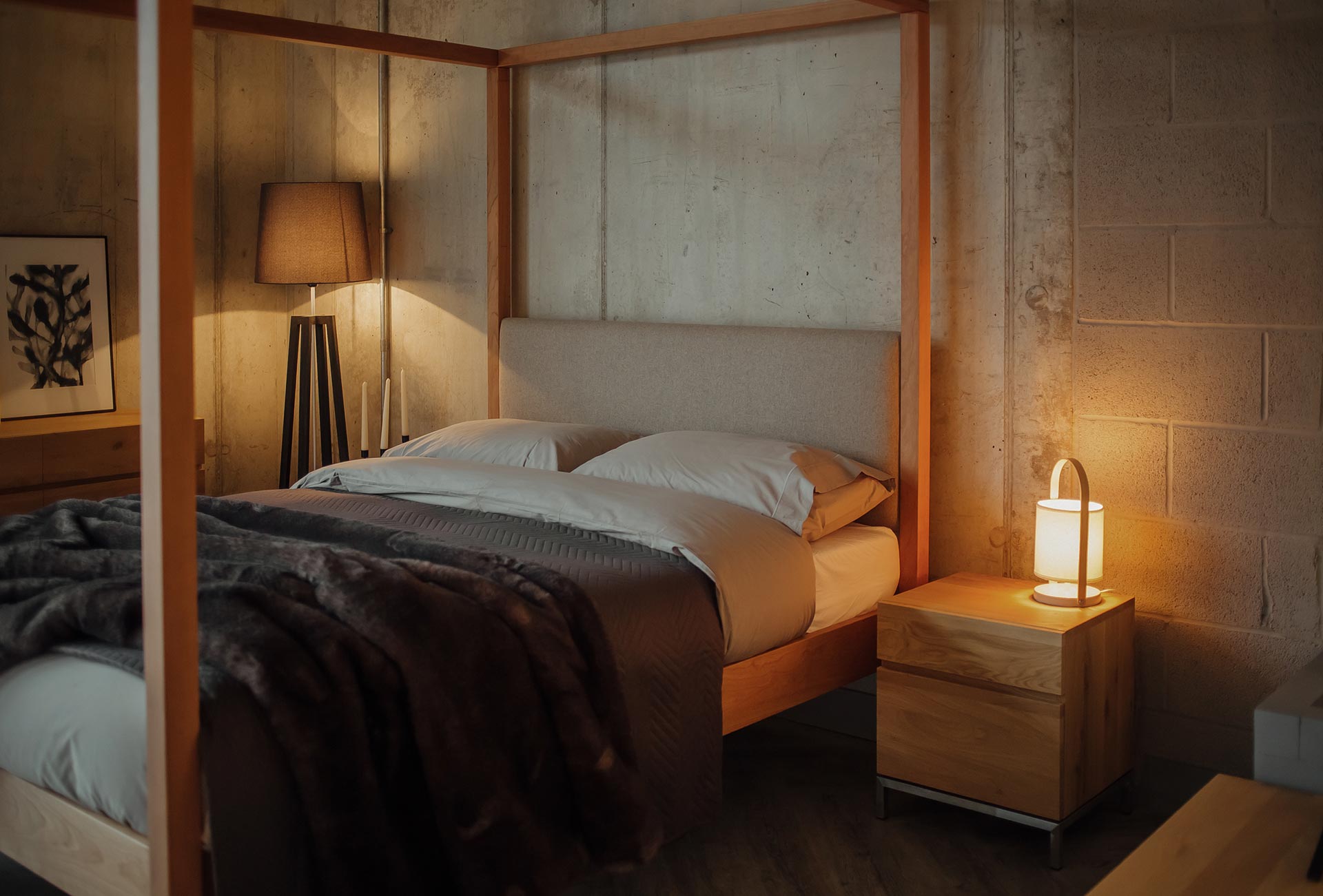 Upholstered 4 poster with slat chevron bedspread and luxury faux fur throw