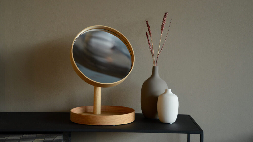 Wireworks oak magnify mirror on fera console table with vases