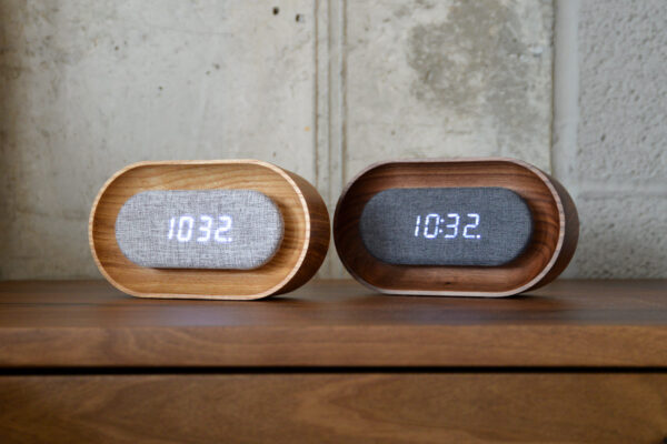 wooden alarm clocks on bedside table.