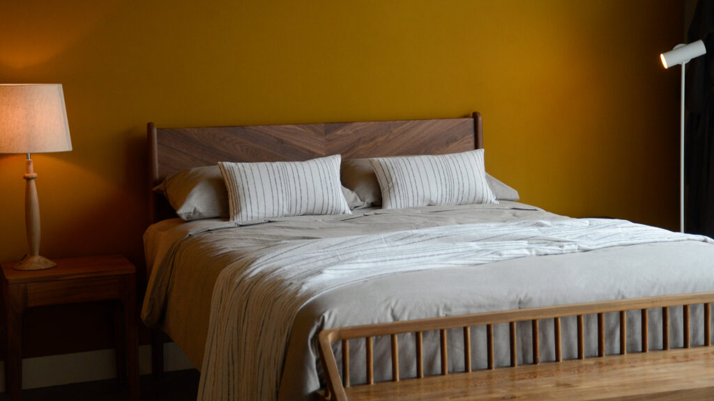 Woven Stripe Throws Charcoal on Walnut Hoxton with cushions