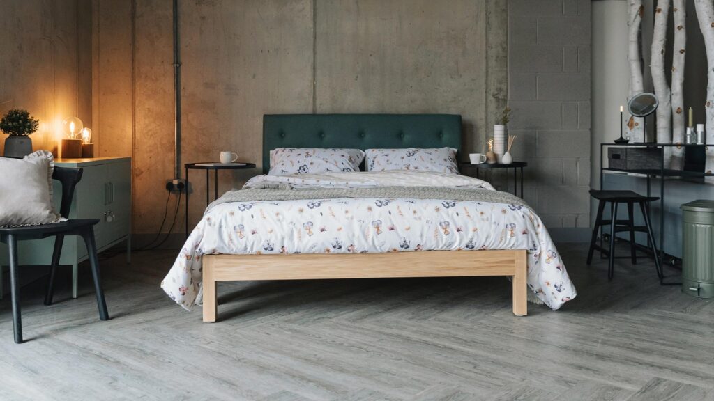 ash Arran bed with green accessories and floral print bedding