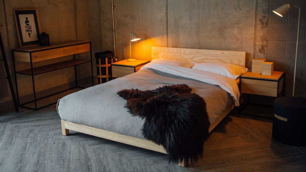 ash sonora bed with black sheepskin throw