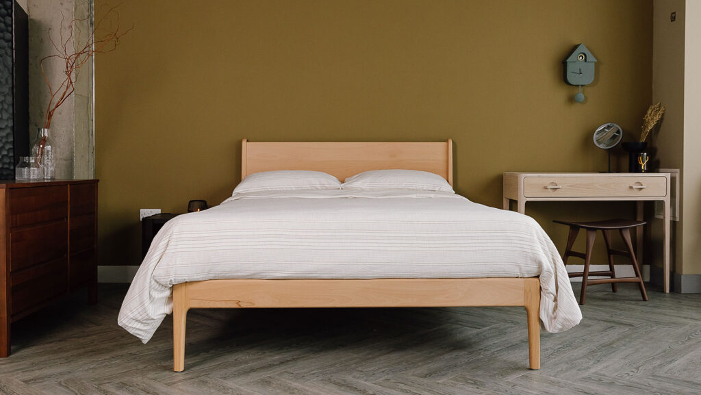 Beech Camden bed with textured bedding set. Room set with white oak desk, Ethnicraft teak stool and accessories.