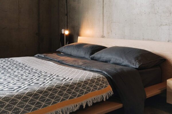 charcoal linen bedding wit boho throw