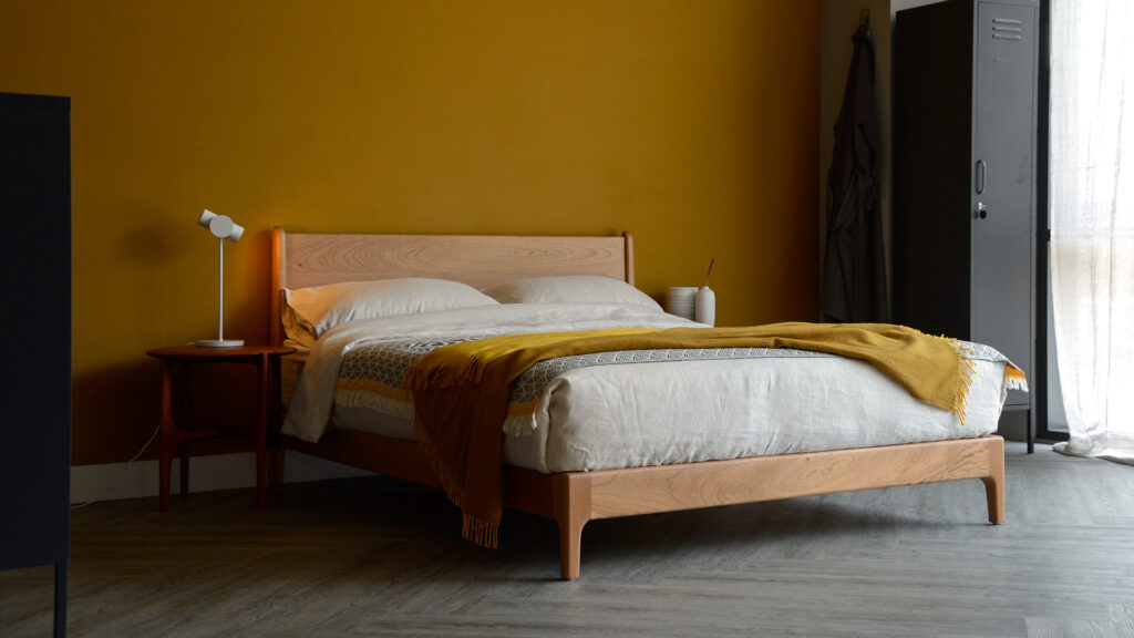 cherry bed carnaby with ochre and ecru bedding.