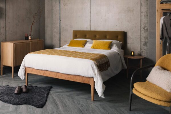 cherry bloomsbury bed with eco velvet upholstery and white and yellow bedding 1350