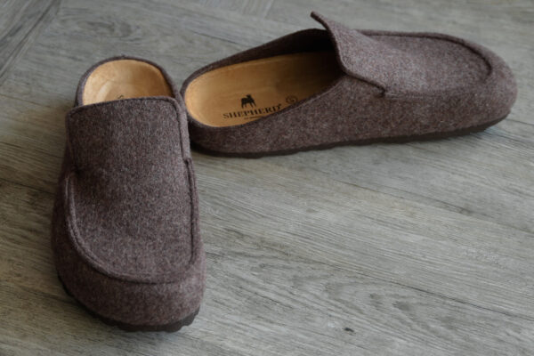 backless wool slippers in warm brown. Shepherd logo visible on sole.