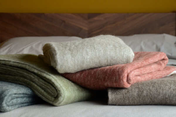 cosy wool rich throws with ivory fringe