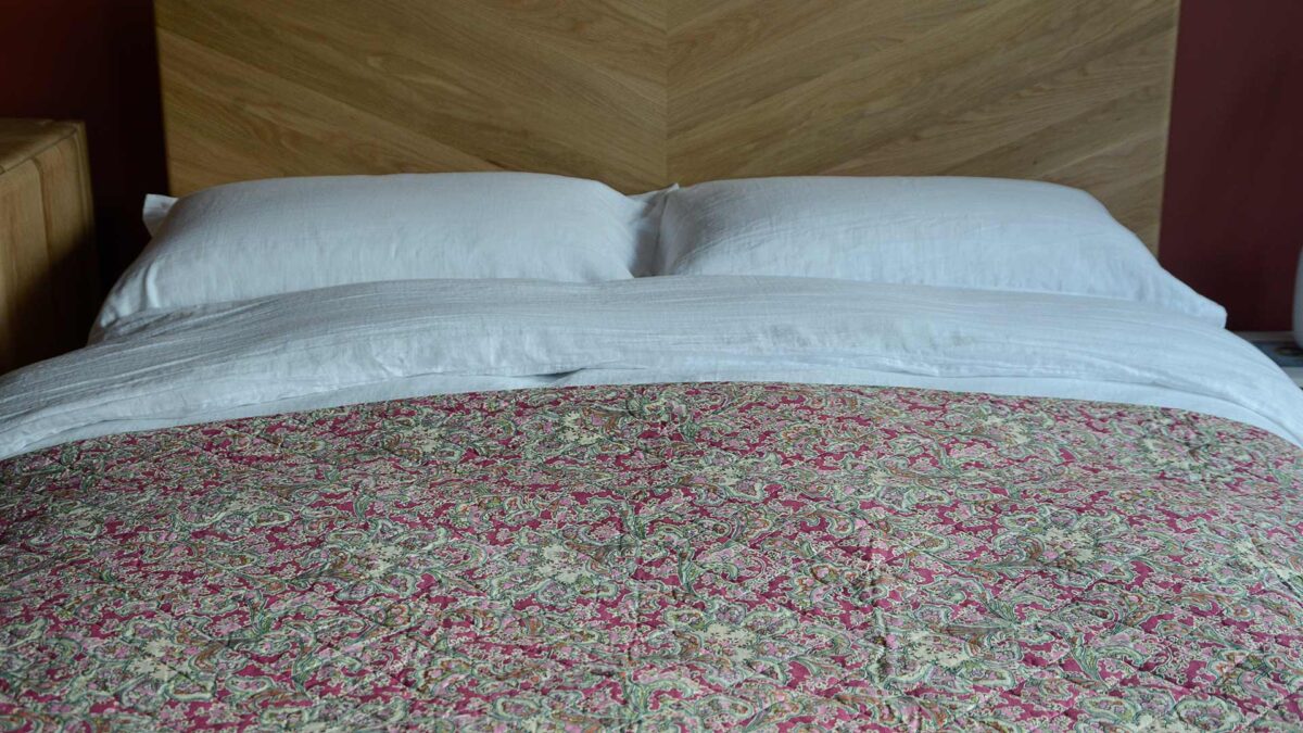Cotton Raspberry Throw Colourful Quilted Throws with Paisley Print | Natural Bed Company