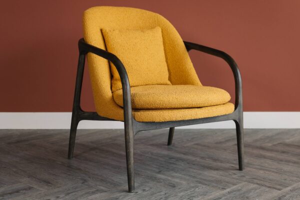 dark wood bedroom chair with mustard upholstery 