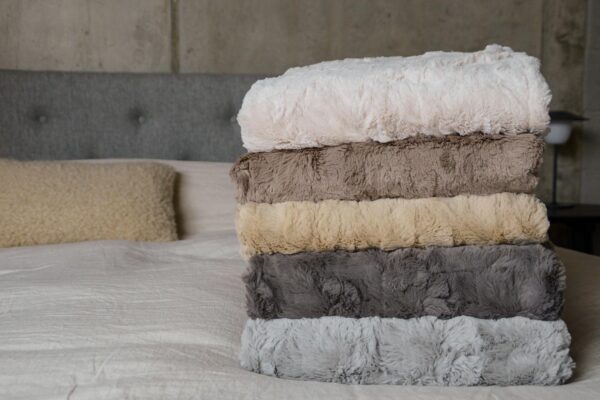 Faux fur throws in five colours with rumpled textures.