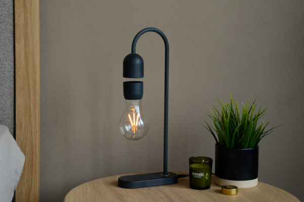 floating lamp on bedside table