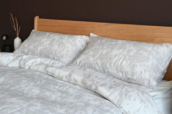 grey floral muslin bedding with white reverse.