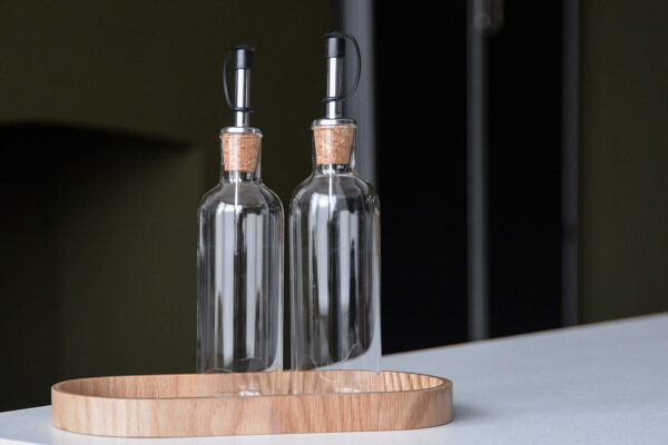 glass oil and vinegar jars with oak tray