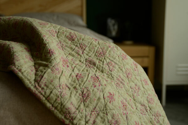 green and pink patterned throw