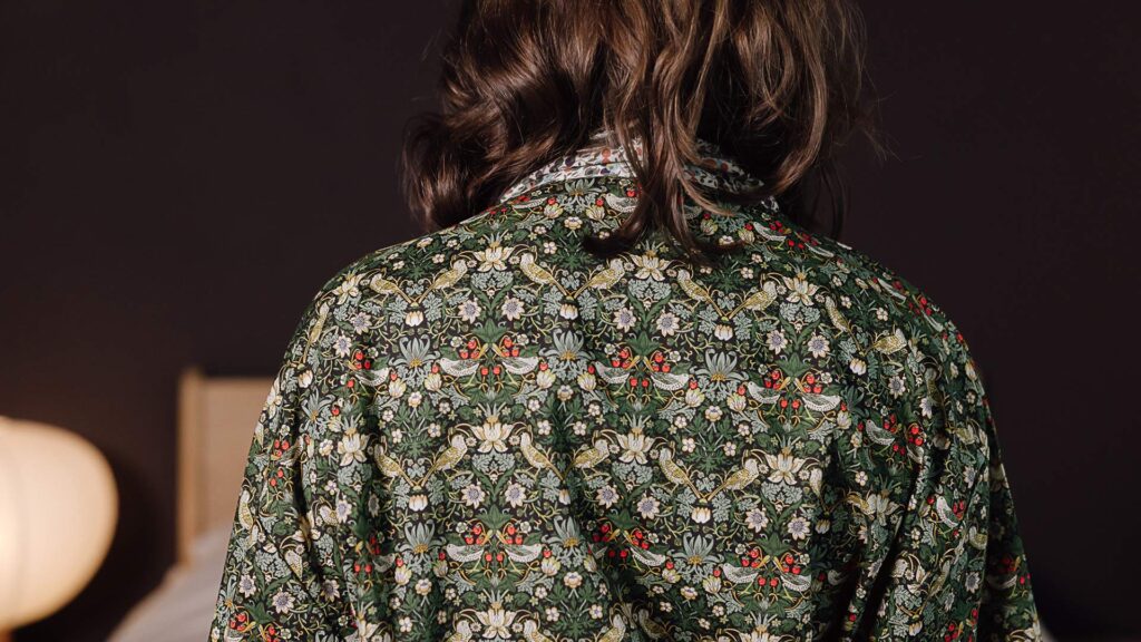 close up of back of liberty print green robe.