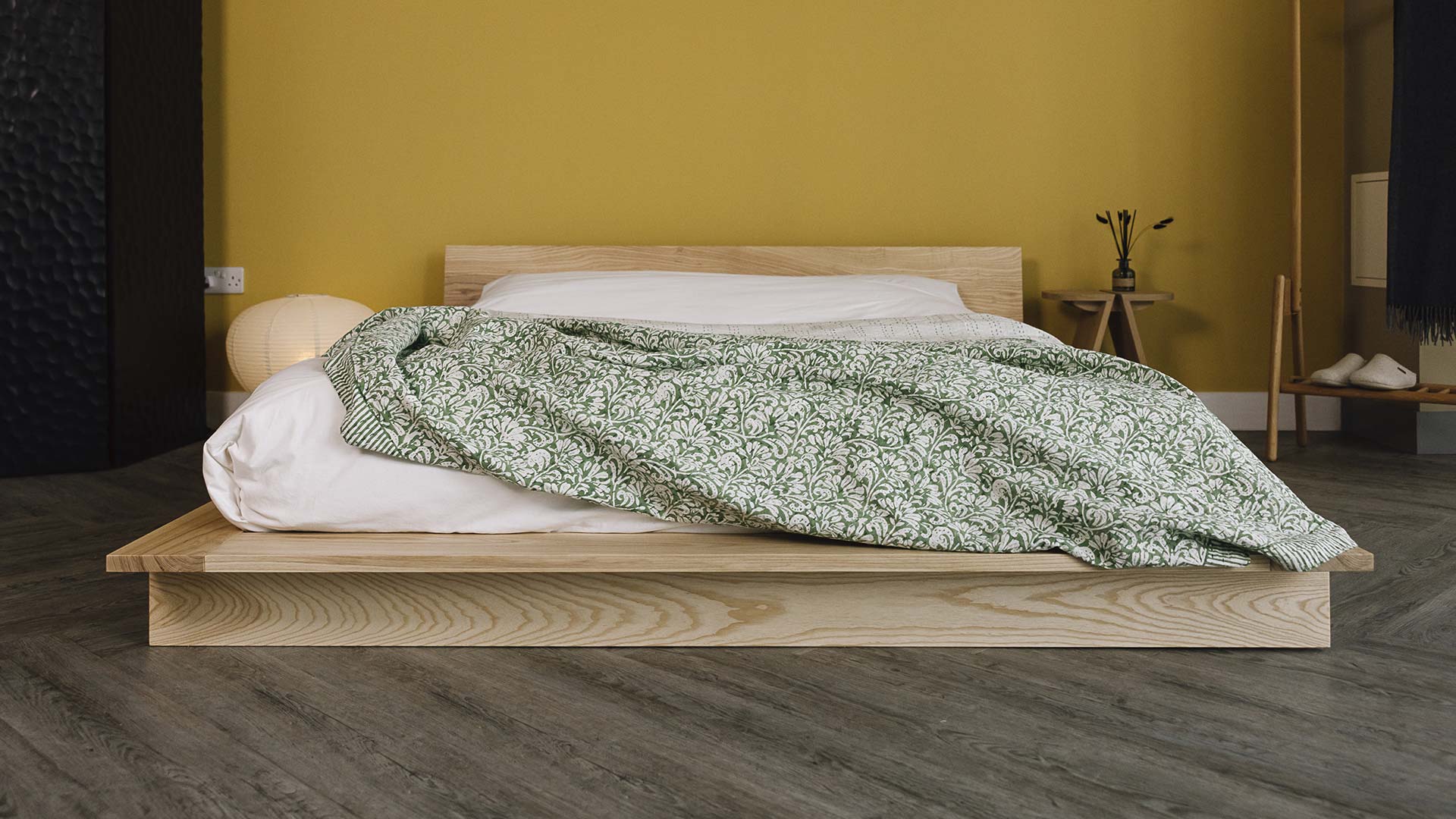 Green floral bedspread on an Oregon bed.