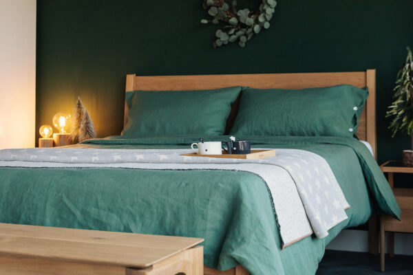 green linen bedding with ceramic cups 1