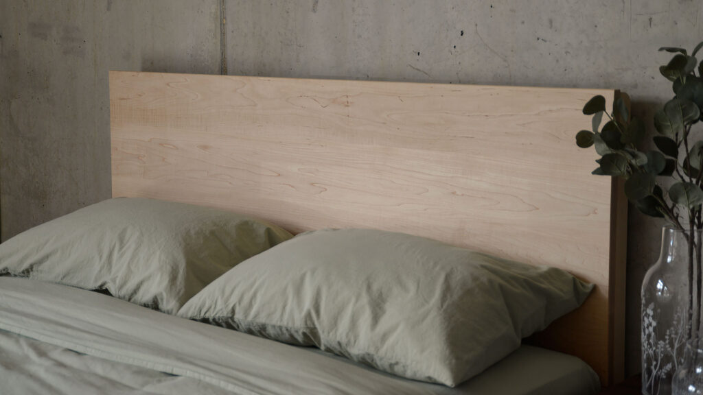 green stonewash bedding with maple headboard Bamford bed