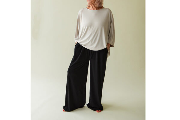 greige lounge top with black wide leg trousers