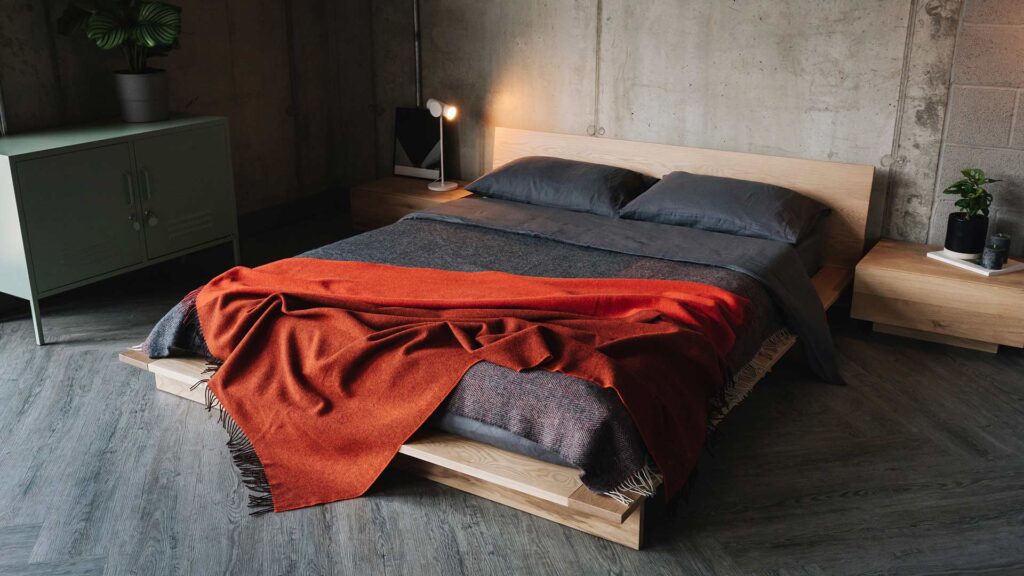 grey and orange bedding on oak Oregon bed