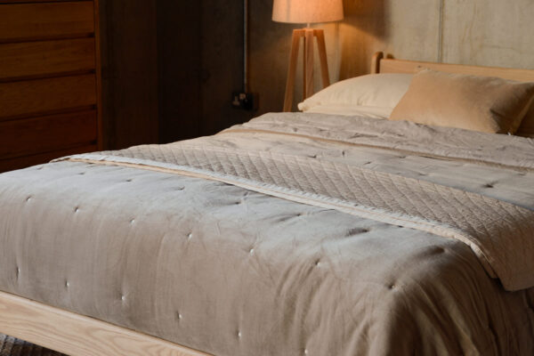 hazelnut velvet bedspread and deep cream throw