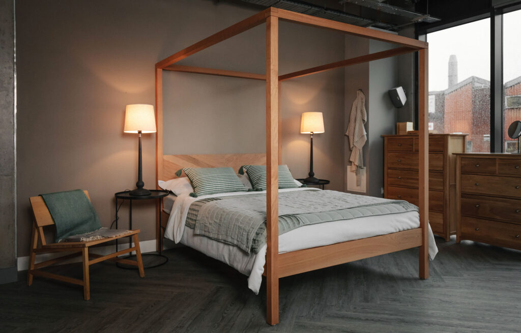 kelham cherry wood four poster with sage green linen throw