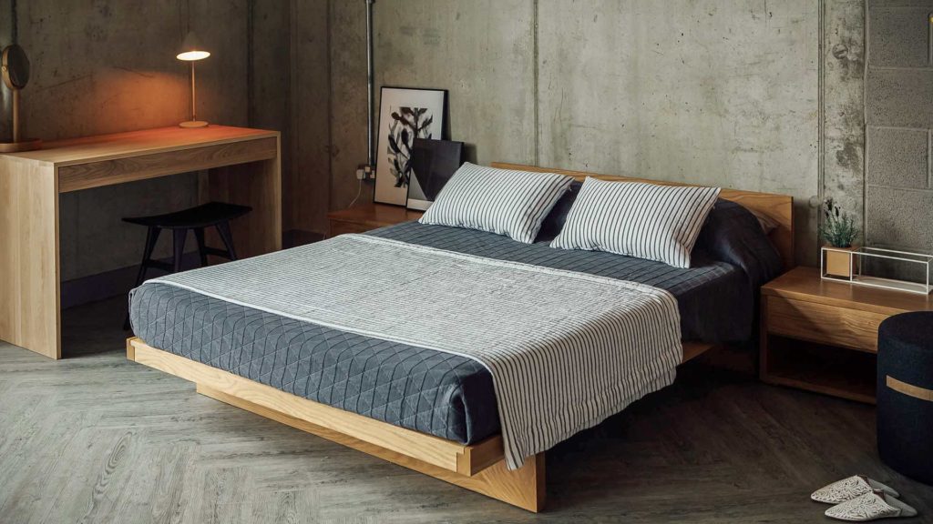 kyoto bed with stockholm bedspread and striped throw and cushions