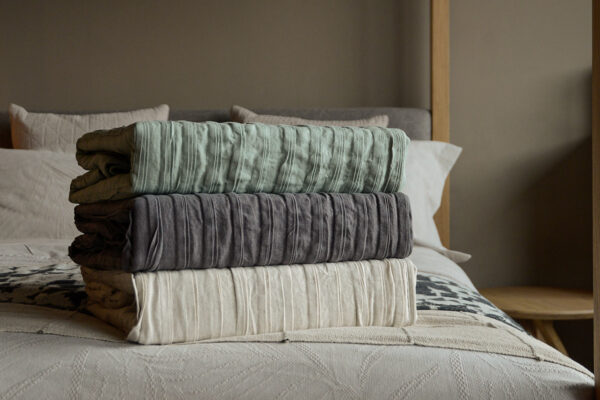 lazy linen ruffle edge throws 3 colours stack