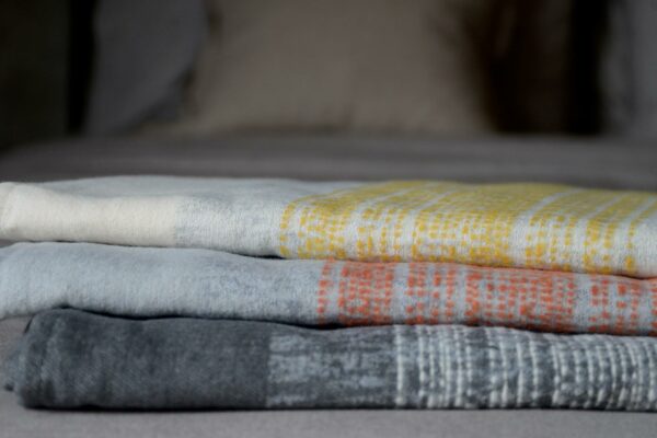 light throws in ivory silver and deep grey