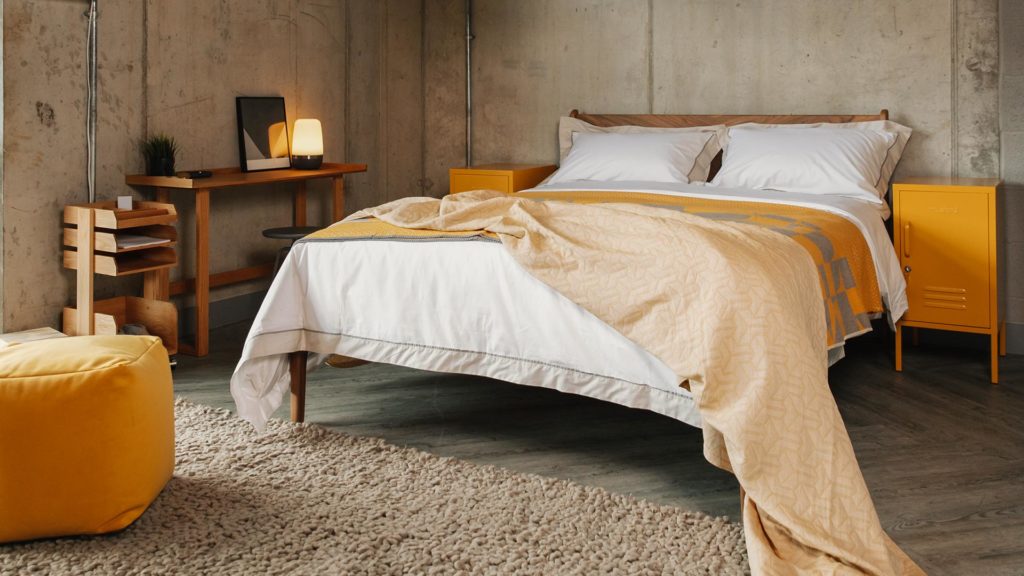 luxury cotton bedding with stone edge and mustard accessories