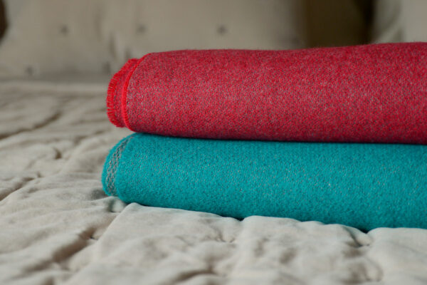 luxury reversible merino throws red or cyan blue