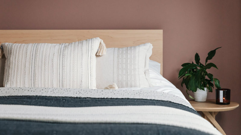 malax embroidered cushion on maple Malabar bed