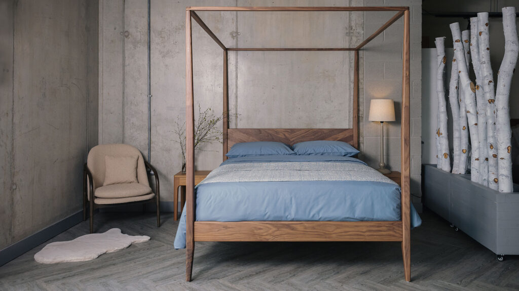 mid century style 4 poster Harrow with blue bedding