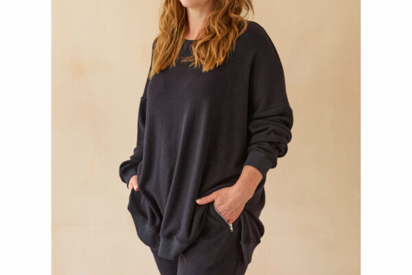Model wearing long midnight blue sweatshirt.