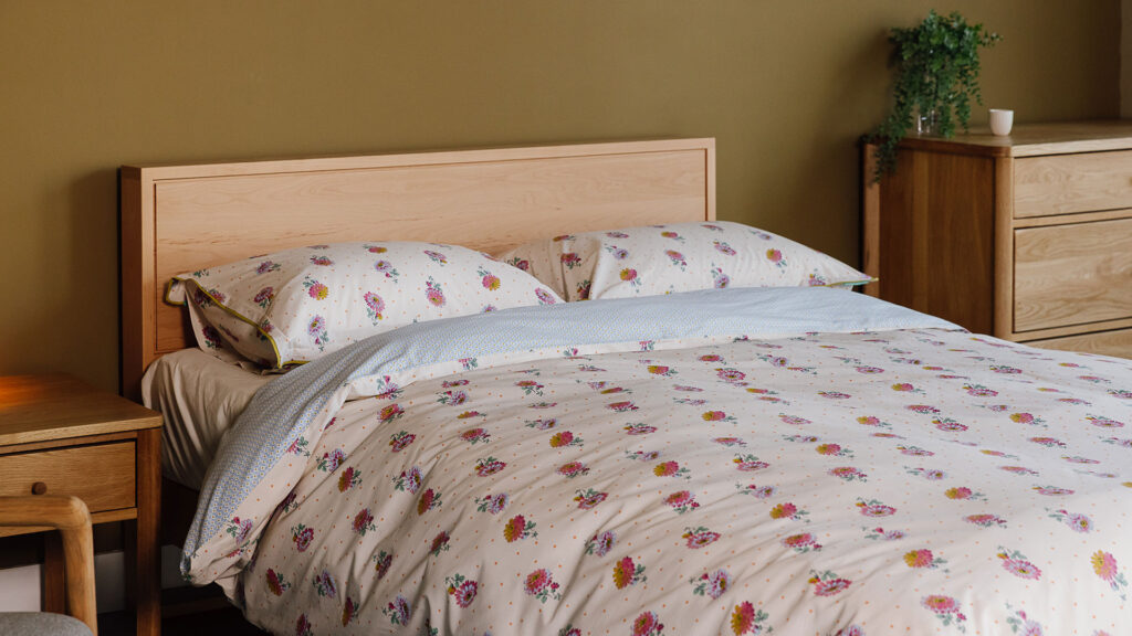 Beech Leith bed with white modern floral bedding.
