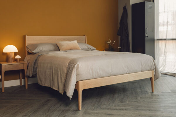 oak camden bed with tawny organic cotton bedding and dark grey lockers.
