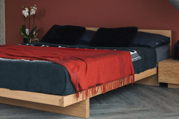 oak Kumo bed with red and black bedding