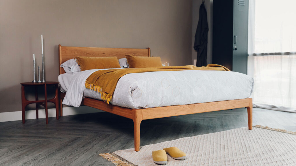 oiled cherry camden bed with honeycomb bedding and ochre accessories