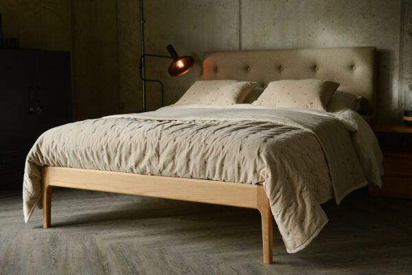 pale plaster velvet quilt and cushions on Bloomsbury bed